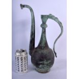 AN EARLY MIDDLE EASTERN BRONZE KHOROSAN EWER. 36 cm high.