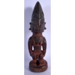 AN AFRICAN TRIBAL CARVED YORUBA PAINTED WOOD FIGURE OF A MALE. 29 cm high.