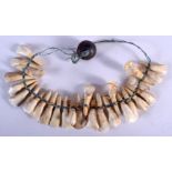 A TRIBAL TOOTH NECKLACE. 21 cm wide.