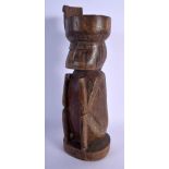 AN UNUSUAL PAPUA NEW GUINEA CARVED TRIBAL WOOD FIGURE possibly Trobriand people. 36 cm high.