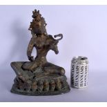 A 19TH CENTURY INDIAN BRONZE BUDDHA modelled playing a sitar. 32 cm x 14 cm.