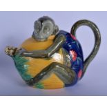 A RARE 19TH CENTURY MINTON MAJOLICA TEAPOT AND COVER in the form of a monkey. 21 cm x 17 cm.