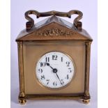 AN EARLY 20TH CENTURY FRENCH BRASS CARRIAGE CLOCK. 11.5 cm x 8.75 cm inc handle.