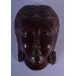 AN 18TH CENTURY EUROPEAN CARVED TREEN WOOD MASK modelled as a female. 12 cm x 7 cm.