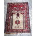 A small Persian rug 117 x 77cm.