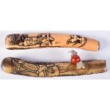 TWO 19TH CENTURY JAPANESE STAG ANTLER PIPECASES, ONE WITH OJIME, CARVED WITH SAMURAI. 20.5cm x 3.2c