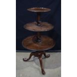 A George III Mahogany dumb waiter C1780, with dished tiers supported on a baluster stem 107 cm , lar