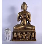 A 19TH CENTURY INDIAN BRONZE FIGURE OF A SEATED BUDDHA modelled upon an openwork base. 38 cm x 16 cm