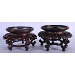 A NEAR PAIR OF 19TH CENTURY CHINESE HARDWOOD STANDS Qing. 12 cm x 9 cm.