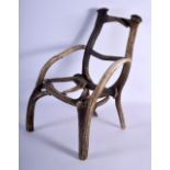 A RARE 19TH CENTURY CONTINENTAL CARVED STAG ANTLER CHILDS CHAIR of naturalistic form. 43 cm x 25 cm.