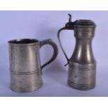 A MID 19TH CENTURY PEWTER TANKARD and a tappit hen. Largest 25 cm high. (2)