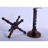A GEORGE III TREEN WOOD JACK and a pig tail twist candlestick. Largest 21 cm high. (2)