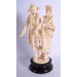 A 19TH CENTURY EUROPEAN DIEPPE CARVED IVORY FIGURE modelled as a dandy and his beau. 26 cm high.