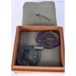 A JAPANESE BRONZE TSUBA TOGETHER WITH A BRONZE HAND MIRROR. Tsuba 5.6cm x 5cm, Mirror 4.7cm diamete