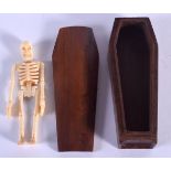 A WOOD COFFIN CONTAINING A BONE SKELETON. 11.7cm x 4.2cm x 3.3cm, weight 89g