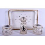 AN ARTS AND CRAFTS GLASS DRESSING TABLE SET. Largest 25 cm x 18 cm. (4)