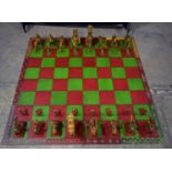 A large scale hand carved Indian bone Chess set and board 178 x 178 cm