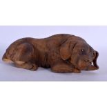 A 19TH CENTURY BAVARIAN BLACK FOREST CARVED WOOD DOG in the manner of Walter Mader. 21 cm x 9 cm.