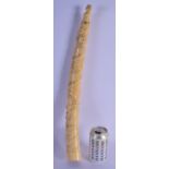 A RARE 19TH CENTURY AFRICAN TRIBAL CARVED LOANGO CARVED IVORY TUSK decorated with animals and dinosa