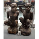 A VERY LARGE PAIR OF 19TH CENTURY CONTINENTAL CARVED WOOD FIGURES possibly Tribal, modelled as a fem