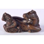 A CHINESE BRONZE SCROLL WEIGHT IN THE FORM OF A MAN WITH A HORSE. 4.25cm x 7.7cm, weight 211g