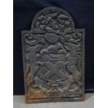 An antique cast iron fire back 61 x 39 cm.