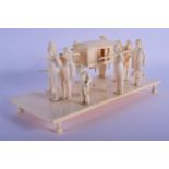 A LARGE 19TH CENTURY ANGLO INDIAN CARVED IVORY CARRIAGE modelled with numerous attendants. 20 cm x 9