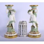 MINTON PAIR OF SEVRES STYLE CHERUB CELADON CANDLESTICKS WITH GILT HIGHLIGHTS C.1880.24cm high (Pr)