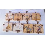 A set of eight wrought iron mounted continental tiles . 20 x 20cm (8).