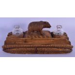 AN ANTIQUE BAVARIAN BLACK FOREST DESK STAND formed with a roaming bear. 23 cm x 11 cm.