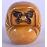 A 19TH CENTURY JAPANESE MEIJI PERIOD CARVED IVORY DARUMA NETSUKE with popping eyes. 4 cm x 2.5 cm.