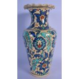 A MIDDLE EASTERN FAIENCE IZNIK STYLE POTTERY VASE painted with flowers. 28 cm high.