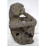 A large South American volcanic stone figure of a seated male 47 x 18 cm.