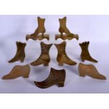 NINE ASSORTED FOLK ART BRASS SHOE STANDS. (9)