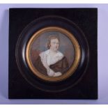 A 19TH CENTURY EUROPEAN PAINTED IVORY PORTRAIT MINIATURE depicting a male wearing ruffled clothing.