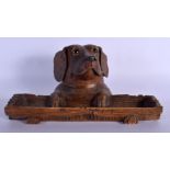 A 19TH CENTURY BAVARIAN BLACK FOREST CARVED WOOD DESK STAND formed as a dog head with inkwell and pe