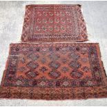 A pair of Persian red ground rugs 76 x 105 cm.