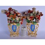 A PAIR OF 19TH CENTURY FRENCH PARIS PORCELAIN VASES with wool work flowers. 36 cm high overall.