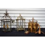 A collection of glass and metal ceiling lanterns with electric fittings , one brass