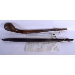 AN UNUSUAL TRIBAL CLUB together with a leather wrapped club. Largest 66 cm long. (2)