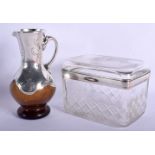 A VINTAGE SILVER OVERLAID GLASS JUG and a crystal glass barrel. Largest 12 cm x 9 cm. (2)