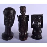 THREE VINTAGE TRIBAL HARDWOOD FIGURES including one of a scarified male. Largest 18 cm high. (3)