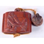A JAPANESE WOOD INRO CARVED WITH A MAN AND A FISH. 6cm x 8cm, weight 86g