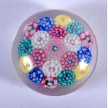 A MINIATURE CLICHY STYLE GLASS PAPERWEIGHT. 4 cm wide.