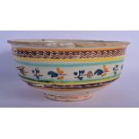 A 17TH/18TH CENTURY SOUTH EUROPEAN FAIENCE GLAZED BOWL painted with sparse foliage. 24 cm x 12 cm.