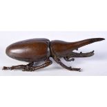 A JAPANESE BRONZE STAG BEETLE. 2.5cm x 7.5cm, weight 85g