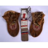 A PAIR OF TRIBAL BEADWORK SHOES together with a similar bead belt. Largest 27 cm wide. (3)