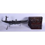 AN ARTS AND CRAFTS CARVED WOOD CASKET together with a bronze gondola. Largest 42 cm wide. (2)