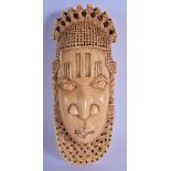 A 19TH CENTURY WEST AFRICAN NIGERIAN CARVED IVORY BENIN MASK possibly representing a Queen, modelled