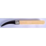 A VICTORIAN CARVED RHINOCEROS HORN MOUNTED IVORY LETTER OPENER. 71 grams. 34 cm long.